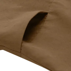Brown casual pants pocket detail shot, showing fine stitching and solid fabric texture.