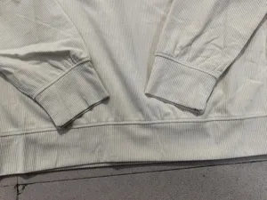 Men corduroy sweatshirt detail view showing textured ribbed cuffs and hem close up craft
