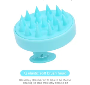 Brosse de massage du cuir chevelu en silicone et peigne de lavage en couleur bleue.