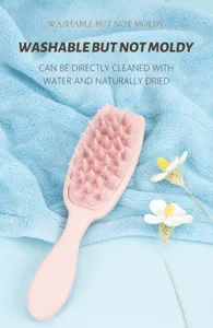 Soft silicone scalp massage brush detail view showing dense bristles and easy-grip handle.