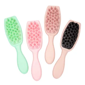 Soft silicone hair brush and scalp massage tool with gentle bristles for shampoo use.