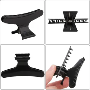 Pinza per capelli nera molletta parrucchiere a farfalla per salone e styling quotidiano dei capelli.