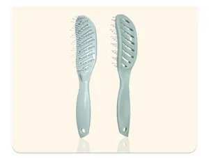 Detailed view of the curved vent hair brush showing front and back design in light green.