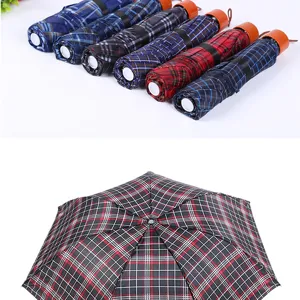 Mini portable three-fold plaid umbrella, stylish waterproof sun umbrella for daily use.