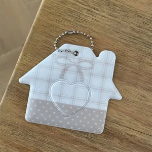 House shaped ID photo card holder close up detail, cute plaid pattern with heart window.