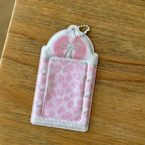 Pink leopard print 3-inch photocard holder, cute rhinestone bow design, ideal for ID cards.