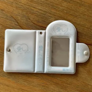 Detailed view of the cute light blue photocard holder with heart design and snap button.