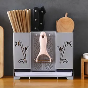 Support de rangement multifonctionnel pour couteaux et baguettes en plastique gris.