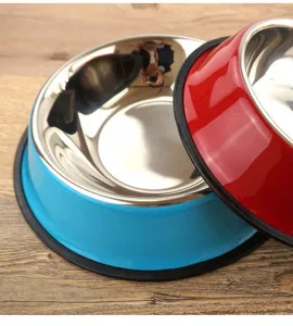 Stainless steel pet bowl detail showing dual color red and blue design with rubber base.