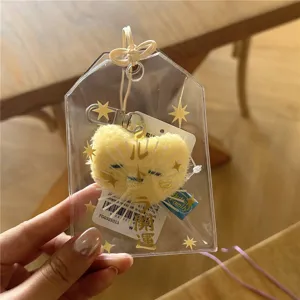 Transparent PVC omamori card holder for 3-inch photocard storage with cute plush toy pendant.