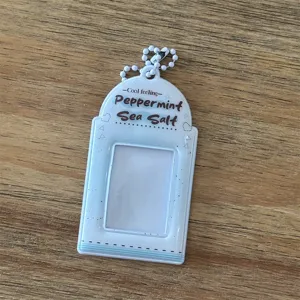 Aesthetic 2-inch photocard holder ID card protector with white ball chain for daily use.