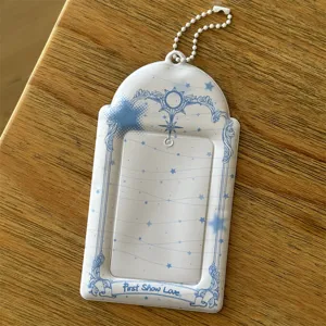 Cute 3-inch photocard holder with celestial blue frame and ball chain for idol cards.