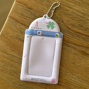 Detailed shot of pink 3-inch photo card holder with cute print design and ball chain.