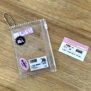 Close-up detail shot of transparent glitter candy zipper card holder pouch with metal chain.