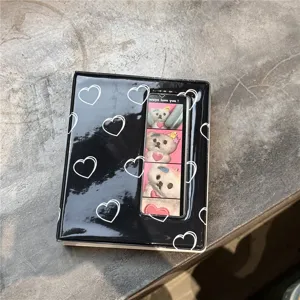 Mini 3-inch black heart pattern photocard binder detail view, cute collectible card album.