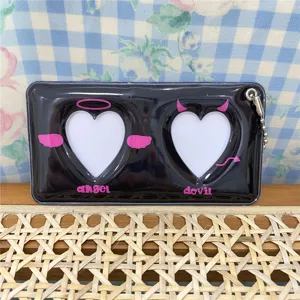 Black heart photocard holder detail view featuring dual window design with cute angel and devil theme.