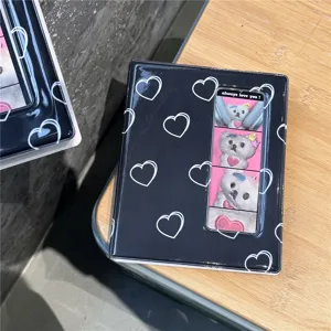 Close-up detail of a black heart pattern photo card binder, showcasing front slot design.