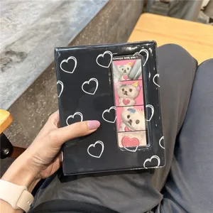 Black mini photocard album with white heart patterns, 3-inch polaroid storage book for photocards.