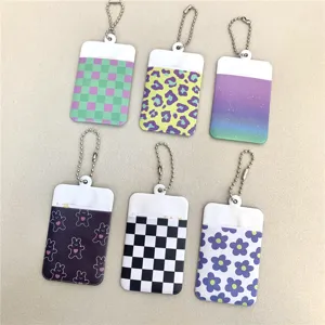 Cute 2-inch photocard holder keychain with various colorful pattern designs for daily use.