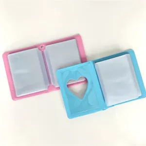 Detail view of 3-inch mini photocard binder album with heart cutout, pink and blue colors.