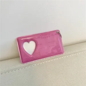Pink heart PVC photocard holder ID card protector with cute keychain pendant for idols.