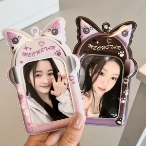 Close-up detail of cute cat ear PVC photocard holder, heart headphone design for 3 inch idol cards.