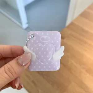 Purple polka dot angel heart photocard holder keychain detail shot showing cute acrylic design.