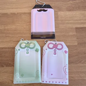 Matte amulet PVC card holder for 3-inch photocards, cute mustache and ribbon design with chain.