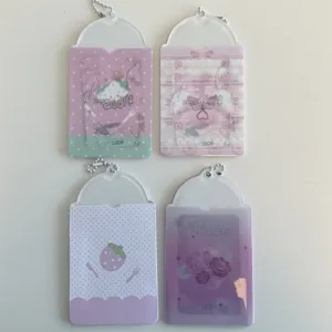 Cute PVC photocard holder detail shot, strawberry and rose design with ball chain for collection.