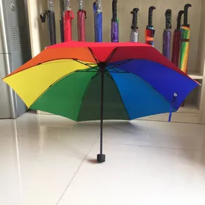 Detailed view showing vibrant rainbow umbrella colorful panels and sturdy frame inside.