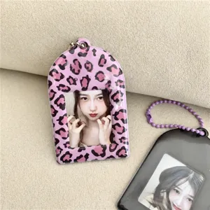 Cute pink purple leopard print acrylic photocard holder keychain for idol photocards.