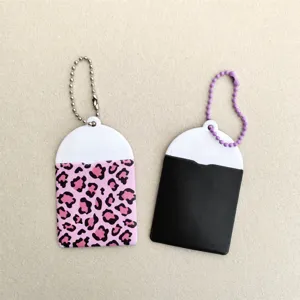 Close-up detail of cute leopard print and solid card holder sleeves with bead chains for IDs.