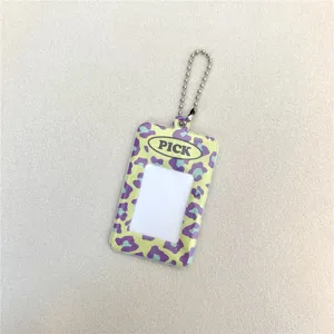 Acrylic photo card holder detail closeup, transparent cute keychain for idol photocards and id cards.