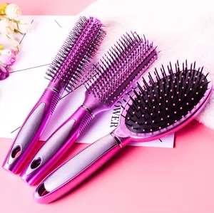 Pink hairbrush set detail showing round, paddle and cushion massage brushes with anti-static design.