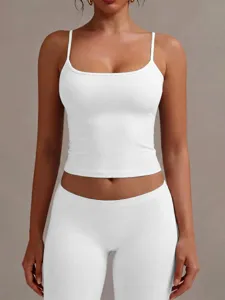 Detailed view of the women's solid white low scoop neck tank top, soft fabric and slim fit.