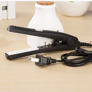 Mini hair straightener flat iron detail view, portable curling hair styling tool for travel.