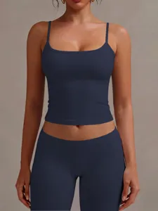 Close-up detail of women's dark blue square neck cropped camisole top and matching leggings.