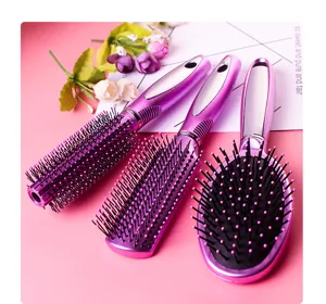 Detailed view of pink hair brush set, including styling, paddle, and cushion massage brushes.