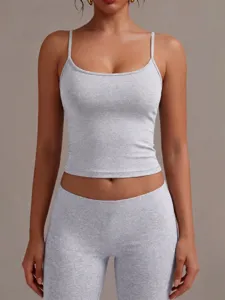 Detail view of women's grey low round neck ribbed tank top worn by a model in studio.