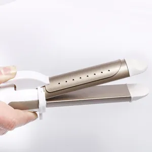 Detail view of the 2-in-1 hair straightener and curler with champagne gold heating plates.