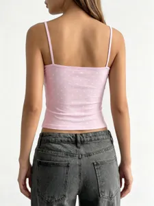 Top corto rosa a pois da donna, canotta estiva sexy attillata con spalline sottili.