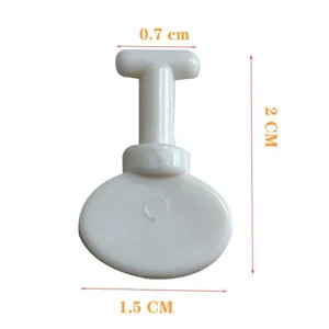 White plastic child safety socket protector detail view showing dimensions and design.