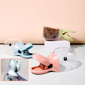 Belle pelle à nourriture pour animal de compagnie en forme de canard et clip étanche.