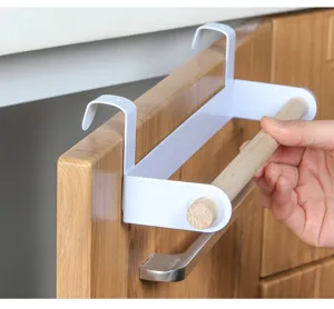 Punch-free cabinet door towel rack with wooden bar, perfect for kitchen and bathroom organization.