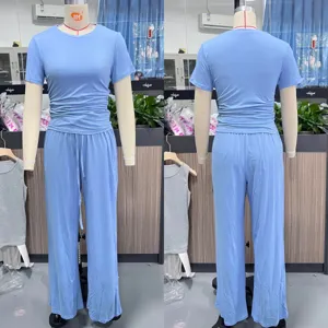 Ensemble deux pièces décontracté uni haut à manches courtes et pantalon long pour l'été.