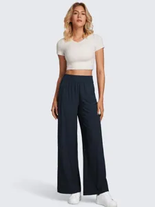 Detail view of casual wide-leg pants high waist design clean finish comfortable fit.