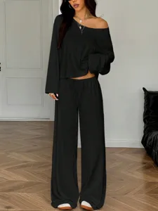 Details of the black off-shoulder long sleeve top and wide leg pants casual lounge set.