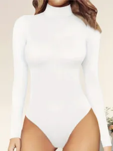 Close-up detail of the white long-sleeve mock neck bodysuit, showing fabric texture and fit.