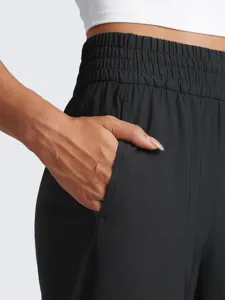 Close up view of women high waist black casual sweatpants pocket detail elastic waistband.