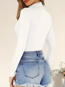 Women white high neck long sleeve slim fit bodysuit paired with blue denim shorts detail